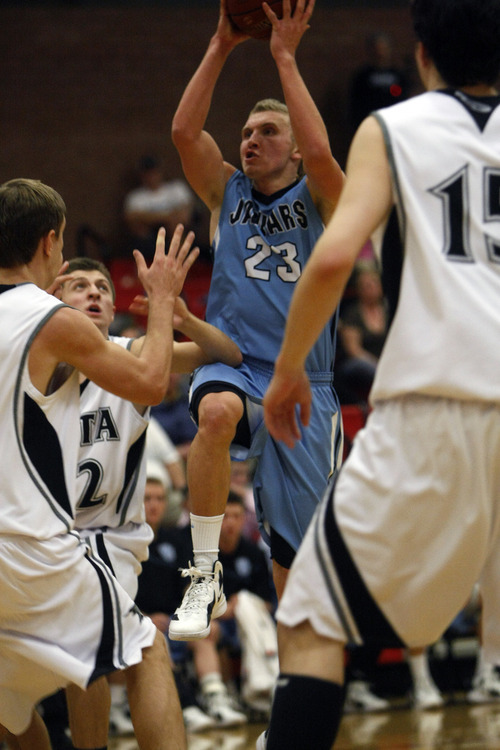 Chris Detrick  |  The Salt Lake Tribune
West Jordan's Jaden Jackson (23) shoots past Alta's RJ Beard (12) and Alta's Tanner Jones (15) during the game at Alta High School Friday February 10, 2012. West Jordan won the game 75-60.
