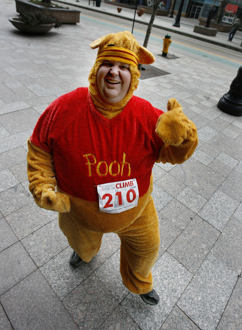 Scott Sommerdorf  |  The Salt Lake Tribune             
Jason Berrett poses in his Pooh Bear costume before his run to the 23rd floor of the Wells Fargo Building during The American Lung Association's seventh-annual Fight for Air Climb, Saturday February 25, 2012.