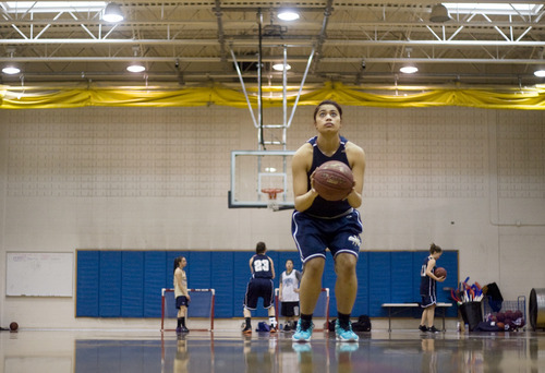Kim Raff |The Salt Lake Tribune
Ta'a Tuinei at her teams practice at Skyline High School in Salt Lake City, Utah on February 9, 2012.  Tuinei decided to play her final season on the team, hoping that basketball will help her to get into college.  Her family helps take care of her son so she can play her final year.  