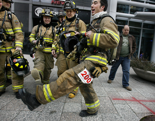 Scott Sommerdorf  |  The Salt Lake Tribune             
Justin Leavitt of the South Salt Lake Fire Department does a high-stepping dance to warm up with other members of his squad prior to the American Lung Association's seventh-annual Fight for Air Climb, Saturday February 25, 2012.
