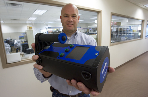 Steve Griffin  |  The Salt Lake Tribune


Rob Harmon, director of business development at D-Tect Systems, holds a rad-ID radiation identifier at company headquarters in Draper, Utah Friday, September 23, 2011.  D-Tect Systems is a small but surging company that manufactures radiation and chemical detection systems for homeland security, police, firefighters and others. It's seen sales soar since 9/11. Its products are used by FDA, FBI, NYPD, Department of Defense, US Army and Air Force as well as the Department of Homeland Security.