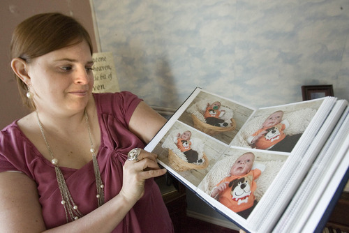 Paul Fraughton | The Salt Lake Tribune.
Camilla Grondhal looks through a scrap book of photos of her son Max, who died from a genetically transmitted condition named Ogden Syndrome
 Tuesday, February 14, 2012