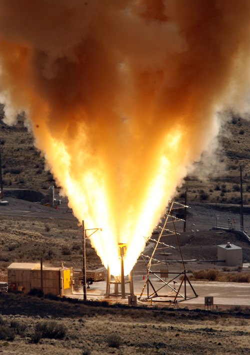 Photo by Leah Hogsten/ The Salt Lake Tribune file photo
Flames shot into the air at ATK's test facility in Promontory during the first ground test of the Orion abort motor in 2008. The motor will provide thrust to lift the crew module off the launch vehicle on NASA's next-generation spacecraft in the event of an emergency.