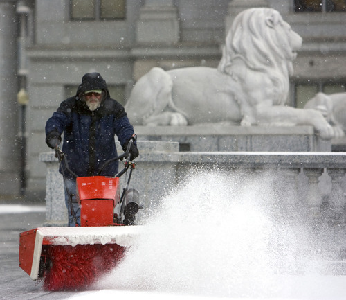 Al Hartmann  |  The Salt Lake Tribune
Bob Steffen, of the Utah State Capitol Grounds Department snow blows the east side entrance Tuesday morning February 28.