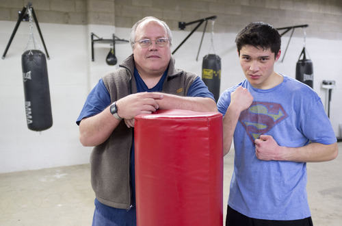 Trent Nelson  |  The Salt Lake Tribune
Danny Galloway, right, with his coach Mel Rogers. Galloway is a 16-year-old boxer who is the best, among all ages, in the state. Galloway was photographed working out at Fight For Your Life, a boxing and fitness gym Thursday, February 23, 2012 in Salt Lake City, Utah.