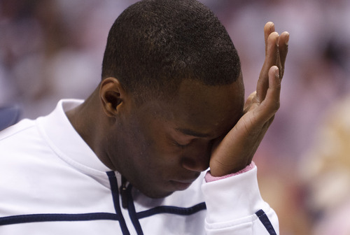 Trent Nelson  |  The Salt Lake Tribune
Senior BYU guard/forward Charles Abouo (1) gets emotional as he's recognized before his final home game. BYU vs. Portland, college basketball Saturday, February 25, 2012 in Provo, Utah.