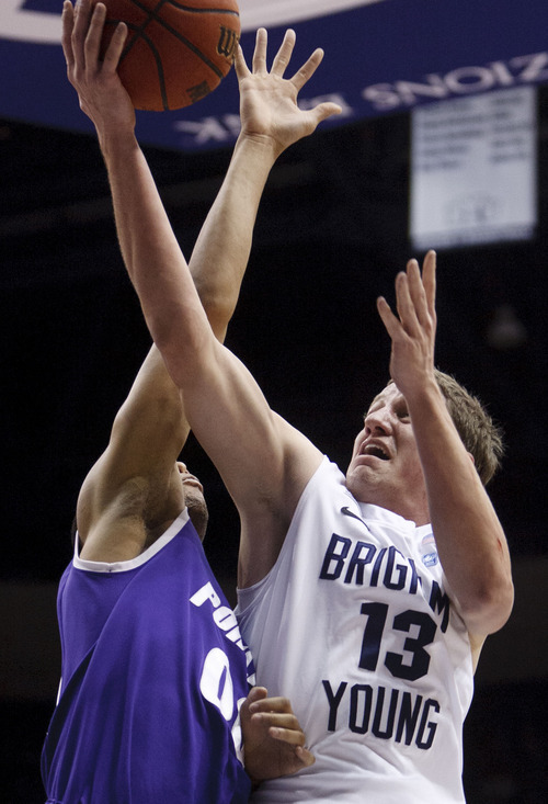 Trent Nelson  |  The Salt Lake Tribune
BYU guard/forward Brock Zylstra (13) drives to the basket, defended by Portland guard Kevin Bailey (00). BYU vs. Portland, college basketball Saturday, February 25, 2012 in Provo, Utah.