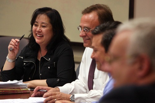 Leah Hogsten  |  The Salt Lake Tribune
Salt Lake County Councilwoman Jani Iwamoto, in this file photo, meets with fellow council members Max Burdick, center, and Michael Jensen. Iwamoto has decided against seeking a second term.