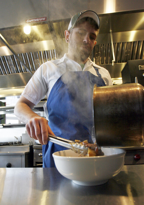 Francisco Kjolseth  |  The Salt Lake Tribune
Plum Alley chef Ryan Lamon serves up kimchi stew.