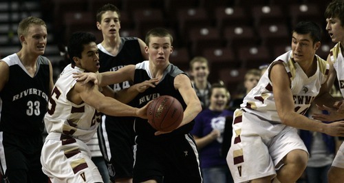 Kim Raff  |  The Salt Lake Tribune
Viewmont player (left) Jarom, Tye and Riverton player D Mccleary fight for a loose ball during the 5A UHSAA State Tournament at the Maverick Center in Salt Lake City, Utah on February 28, 2012.  Riverton went on to win the game 52-21 in double overtime.