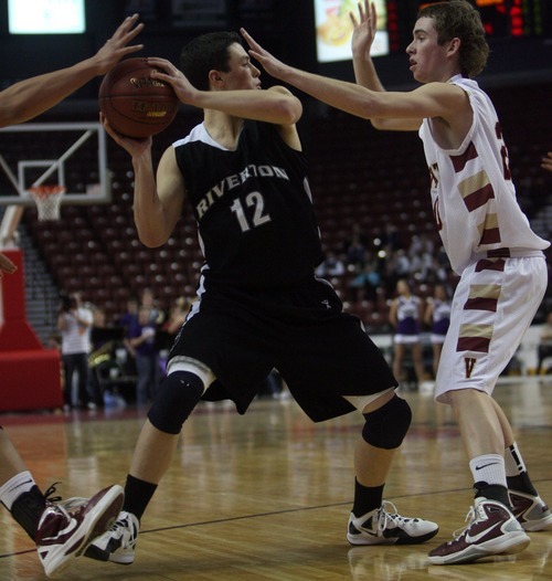 Kim Raff  |  The Salt Lake Tribune
Viewmont player (right) Tanner Gamble defends Riverton player Austin Anderson during the 5A UHSAA State Tournament at the Maverick Center in Salt Lake City, Utah on February 28, 2012.  Riverton went on to win the game 52-21 in double overtime.
