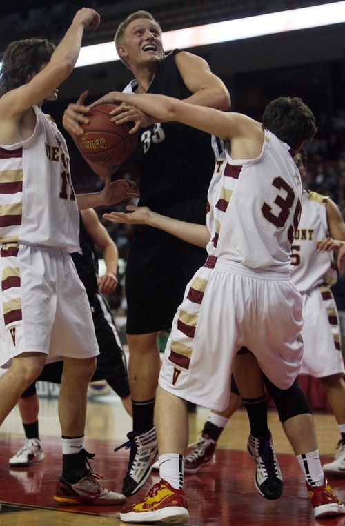 Kim Raff  |  The Salt Lake Tribune
Viewmont players (left) Travis Tiner and McKay Richins defend as Riverton player Bryce Stone tries to take a shot during the 5A UHSAA State Tournament at the Maverick Center in Salt Lake City, Utah on February 28, 2012.  Riverton went on to win the game 52-21 in double overtime.