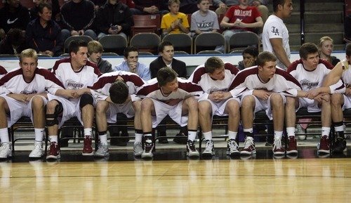 Kim Raff  |  The Salt Lake Tribune
The Viewmont bench locks arms in the few minutes of the fourth quarter during a game against Riverton for the 5A UHSAA State Tournament at the Maverick Center in Salt Lake City, Utah on February 28, 2012. Riverton went on to win the game 52-21 in double overtime.