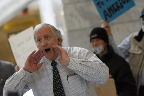 Francisco Kjolseth  |  The Salt Lake Tribune
Warren Brodhead, a former high school teacher, lends his voice as he joins Occupy activists in a political theater performance in the Capitol to protest corruption of government.