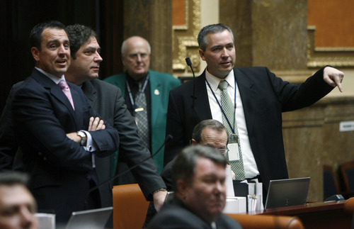 Francisco Kjolseth  |  The Salt Lake Tribune
Representative Daniel McKay, R-Riverton, far right, votes against SB41, which regulates tanning facilities as he watches the votes alongside representives Greg Hughes, R-Draper, left, who also voted against the bill and Brian King, D-Salt Lake, who voted in support on Wednesday February 29, 2012.