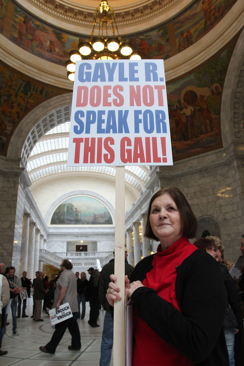 Francisco Kjolseth  |  The Salt Lake Tribune
Gail Turpin, 66, holds a sign that distinguishes herself from Utah Eagle Forum President Gayle Ruzika, who opposed an anti-discrimination bill this session. Turpin, a Cottonwood Heights resident, was one of more than 100 people who rallied in the Capitol on Wednesday to show support for Utah's lesbian, gay, bisexual and transgender community. February 29, 2012.