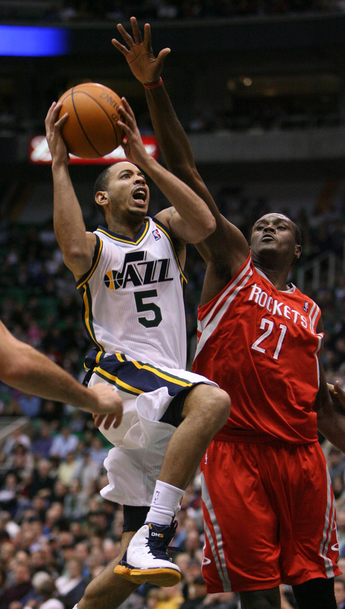 Steve Griffin  |  The Salt Lake Tribune

Utah Jazz guard Devin Harris gets past Houston's Samuel Dalembert as he drives to the basket during first half action in the Jazz Rockets game at EnergySolutions Arena in Salt Lake City, Utah  Wednesday, February 29, 2012.