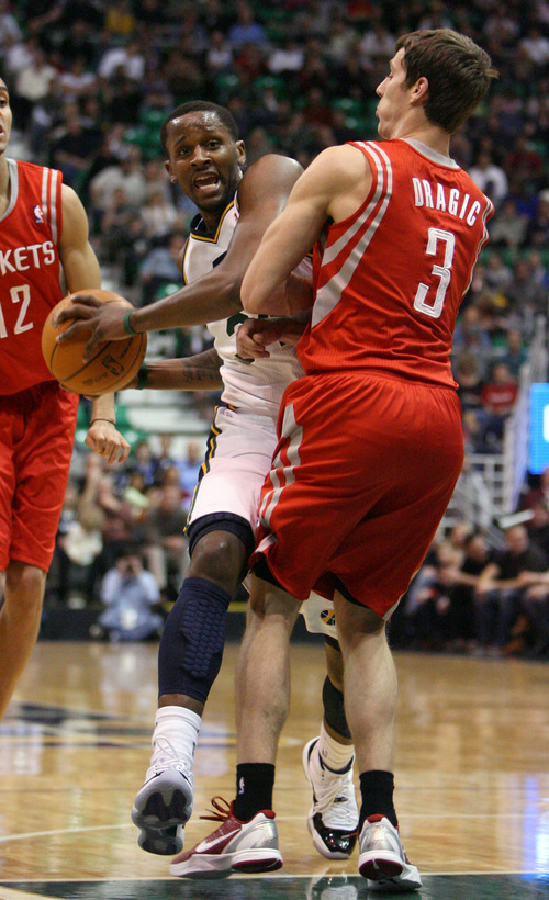 Steve Griffin  |  The Salt Lake Tribune

Utah's C.J. Miles crashes into Houston's Goran Dragic as he drives to the basket during first half action in the Jazz Rockets game at EnergySolutions Arena in Salt Lake City, Utah  Wednesday, February 29, 2012.
