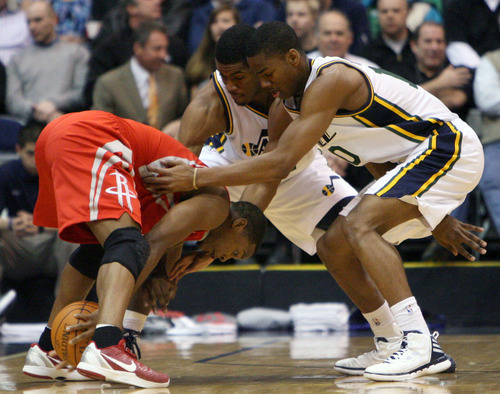 Steve Griffin  |  The Salt Lake Tribune

Utah's Derrick Favors and Alec Burks trap Houston's Kyle Lowry  during first half action in the Jazz Rockets game at EnergySolutions Arena in Salt Lake City, Utah  Wednesday, February 29, 2012.