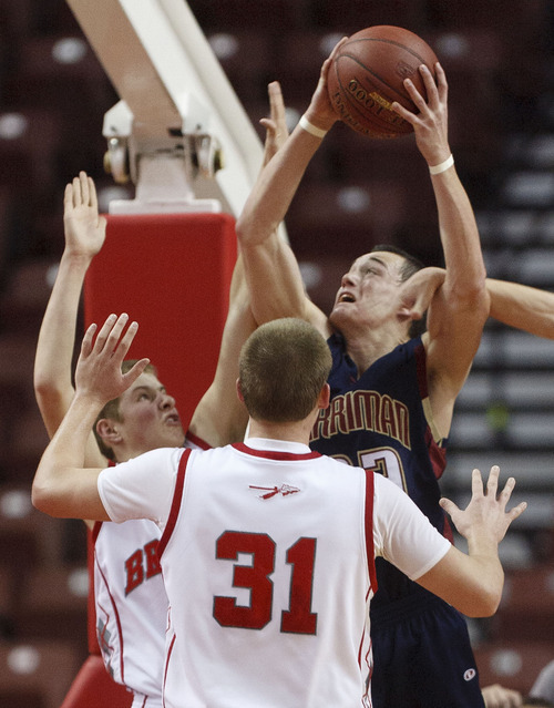 Trent Nelson  |  The Salt Lake Tribune
Herriman's Jaden Rasmussen shoots, with Bountiful's Sam Merrill, left, and Brock Yates defending. Bountiful vs. Herriman, 4A High School Basketball Championships Wednesday, February 29, 2012 at the Maverik Center in West Valley City, Utah.