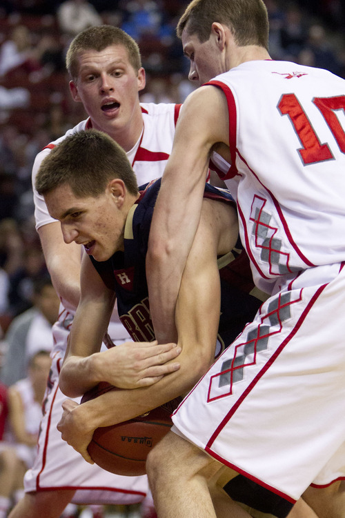 Trent Nelson  |  The Salt Lake Tribune
Herriman's Kyle Sanford, double-teamed by Bountiful's Brock Yates, left, and Brit Harding (10). Bountiful vs. Herriman, 4A High School Basketball Championships Wednesday, February 29, 2012 at the Maverik Center in West Valley City, Utah.