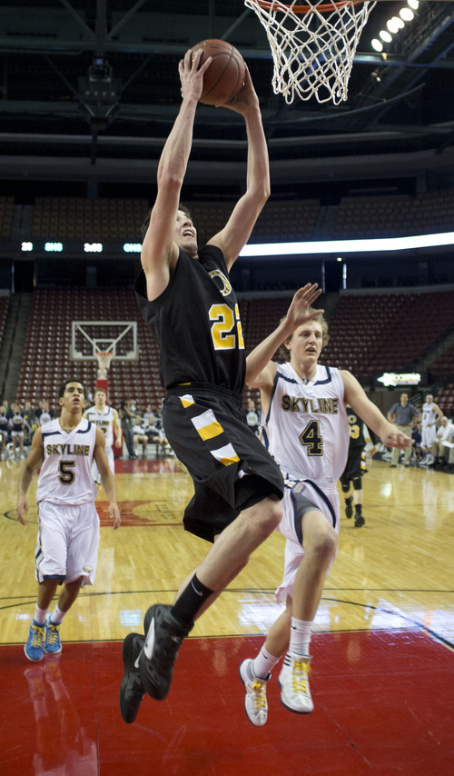 Trent Nelson  |  The Salt Lake Tribune
Orem's Josh Pollard dunks the ball ahead of Skyline's Patrick Nielson. Orem vs. Skyline, 4A High School Basketball Championships Wednesday, February 29, 2012 at the Maverik Center in West Valley City, Utah.