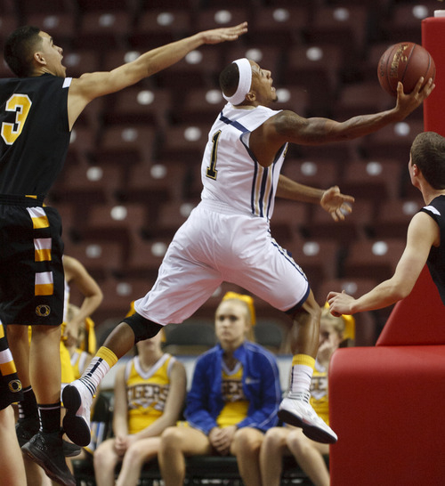 Trent Nelson  |  The Salt Lake Tribune
Skyline's Desean Miller shoots the ball, ahead of Orem's Quinn Peters, left. Orem vs. Skyline, 4A High School Basketball Championships Wednesday, February 29, 2012 at the Maverik Center in West Valley City, Utah.