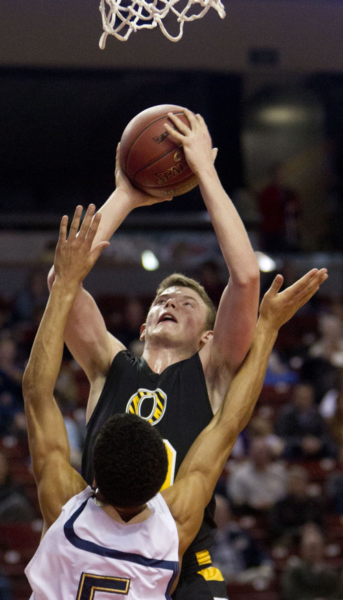 Trent Nelson  |  The Salt Lake Tribune
Orem's Isaiah Fiso shoots the ball over Skyline's Garrett England. Orem vs. Skyline, 4A High School Basketball Championships Wednesday, February 29, 2012 at the Maverik Center in West Valley City, Utah.