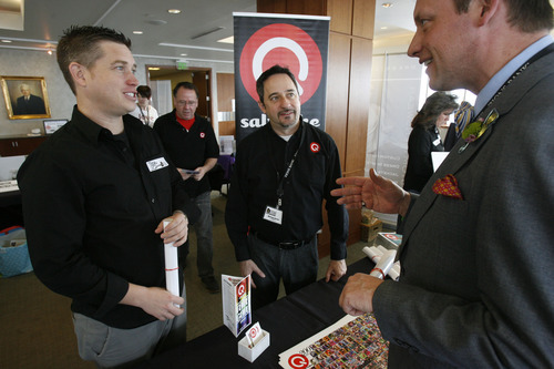 Francisco Kjolseth  |  The Salt Lake Tribune
Joshua Jones, left, and Michael Aaron, center, publisher and owner of Q Salt Lake, Utah's biweekly gay and lesbian newspaper, speaks with Tracy Barlow, owner of floral store The Window Box during the first-ever Gay and Lesbian Business Expo on Saturday.