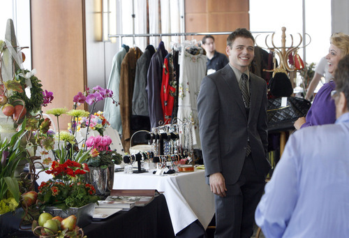 Francisco Kjolseth  |  The Salt Lake Tribune
Derrek Davis, assistant vice president at Zion's Bank, mingles at the Gay and Lesbian Business Expo at the bank on Saturday.