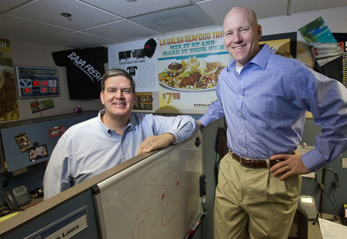 Al Hartmann  |  The Salt Lake Tribune
Mindshare's Rich Hanks, left,  and John Sperry pose in a cubicle filled with 