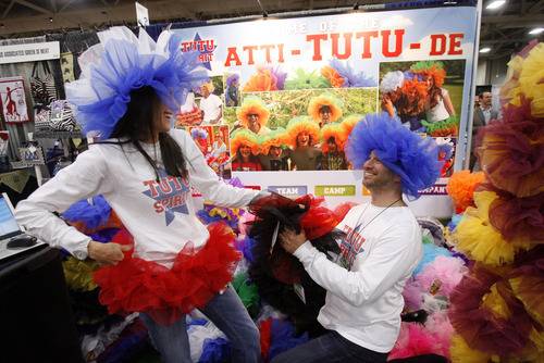 Francisco Kjolseth  |  The Salt Lake Tribune
Alissa and Randy Burns get into the spirit of their tutu creation, surrounded by myriad products aimed at the college student. The Campus Market Expo currently fills the Calvin L. Rampton Salt Palace Convention Center featuring 719 exhibitors in 1,491 booths showing off the latest tech stuff, celebration wears and sports gear being sold at college campus book stores around the country.