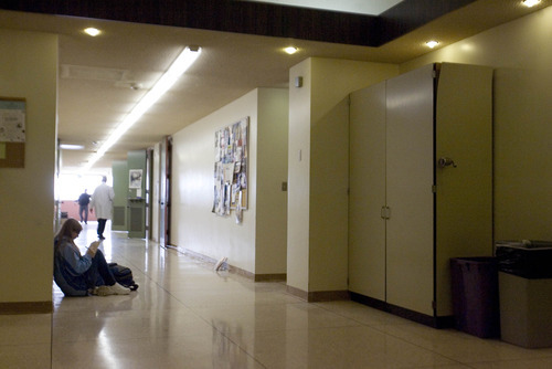 Paul Fraughton  |  The Salt Lake Tribune
A student sits in a hallway of Weber State University's Science Lab Building. With few places for students to gather outside the classroom, the hallway floor is the only option. The outdated labs lack a sprinkler system.