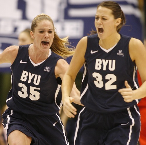 Rick Egan  | The Salt Lake Tribune 

BYU's Kristen Riley celebrates with Dani Peterson, after Peterson's shot gave BYU a bit lead, late in the game, in basketball action, BYU vs. Utah, at the Marriott Center in Provo,   Saturday, December 10, 2011.
