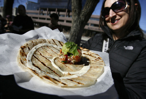 Scott Sommerdorf  |  The Salt Lake Tribune             
Customer Martie Nightingale is happy with her vegan quesadilla from Union Street Eats, a vegan food cart, run by Larayne Clegg, across the street from the Main Library.
