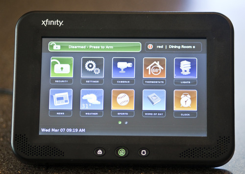 Chris Detrick  |  The Salt Lake Tribune
Comcast has launched Xfinity Home, a security and monitoring service that provides protection against break-ins and also allows homeowners to control certain features in the house remotely. The system's in-home touch screen is pictured.