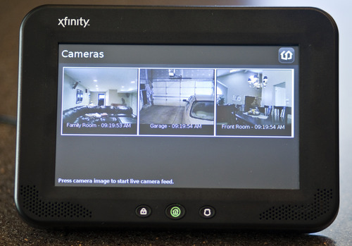 Chris Detrick  |  The Salt Lake Tribune
Comcast has launched Xfinity Home, a security and monitoring service that provides protection against break-ins and also allows homeowners to control certain features in the house remotely. The system's in-home touch screen is pictured.