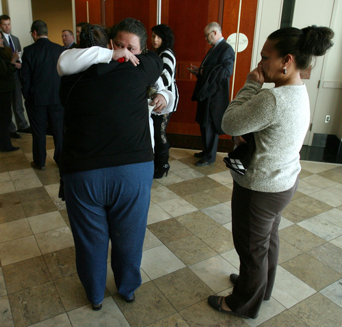 Steve Griffin  |  The Salt Lake Tribune

Seneuefa Farani, left, and Elka Fernandez, center, cry as they embrace outside Judge William Barrett's courtroom following a change of plea hearing at the Matheson Courthouse in Salt Lake City, Utah Thursday, March 8, 2012.  Hunter Farani, Seneuefa's, son, plead guilty to two counts of aggravated kidnapping and one count of aggravated murder for the murder of Fernandez's son, 18-year-old JoJo Lee Brandstatt in 2009.  Farani was barely 14 when he shot Brandstatt for wearing the color of a rival gang.