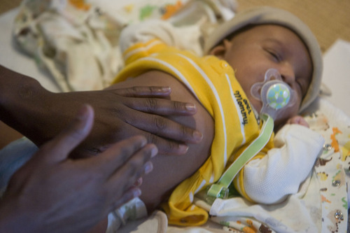 Al Hartmann  |  The Salt Lake Tribune
Abdulkhalia Mohamed massages the chest and stomach of his 5-week-old son Ismail at a class at the Vitalize Community Studio in Salt Lake City.  It was so relaxing that Ismail fell asleep.