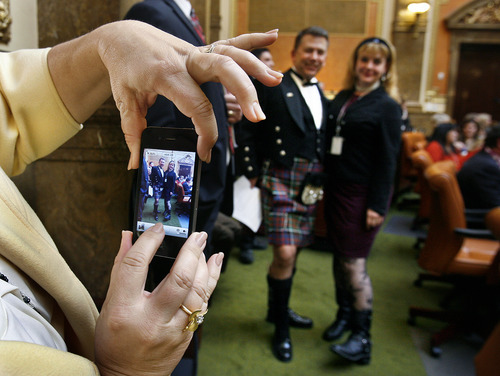 Scott Sommerdorf  |  The Salt Lake Tribune             
Rep. Stephen Sandstrom's wife, Jennie, makes a photo of her husband posing with fellow Rep. Jennifer Seelig, D-Salt Lake, in the Utah House of Representatives Thursday. Sandstrom wanted to get a photo of his kilt on the floor of the House.