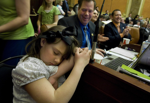 Scott Sommerdorf  |  The Salt Lake Tribune             
Young Alayna Hutchings, daughter of Rep. Eric Hutchings, R-Kearns fell asleep as the Legislature ended it's business in the Utah House of Representatives, Thursday, March 8, 2012.
