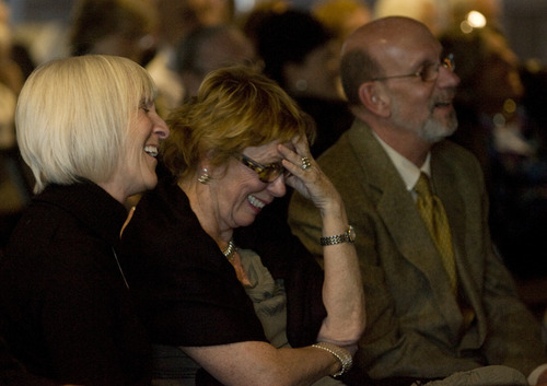 Kim Raff | The Salt Lake Tribune 
(from left) Family friend Terri Jackson, Karen Zumbado, and Steve Wirick, son of Richard Wirick laugh as someone tells a funny story about Richard Wirick during a memorial service for him at the Gallivan Hall at Gallivan Plaza in Salt Lake City on March 8, 2012.