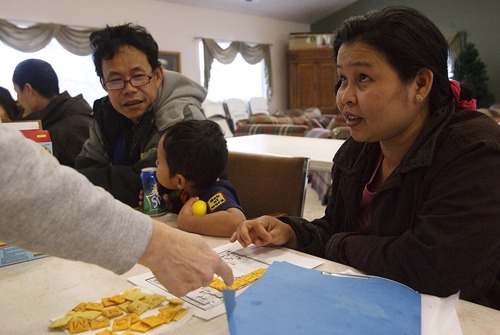 Leah Hogsten  |  The Salt Lake Tribune
KaPaw Htoo's parents Ka Myee, left, and Paw Lae, right, attend an English-as-a-Second-Language class offered four days a week at their Heber apartment complex. The Karen refugees did not speak any English when they arrived in Utah in June.