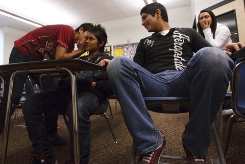 Leah Hogsten  |  The Salt Lake Tribune

Luis Mijares whispers to KaPaw Htoo as they and Ricardo Maciel, right, compete against another team of English language learners in a vocabulary game in their basic English class at Wasatch High. In June, KaPaw Htoo moved to Utah from a refugee camp in Thailand, where he was born to Karen parents fleeing violence in nearby Burma. He did not speak any English when he arrived, but his vocabulary is growing with a class schedule that focuses heavily on learning English.