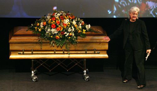 Steve Griffin  |  The Salt Lake Tribune

Meghan Holbrook, former chairwoman of the Utah Democratic Party, touches the casket of Todd Taylor during funeral services Monday for the longtime director. He served under six party chairs and was the longest serving state Democratic Party director in the nation.