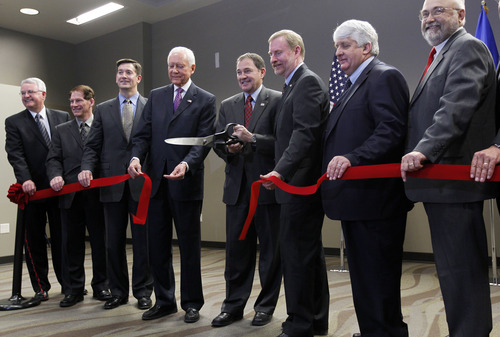 Al Hartmann  |  The Salt Lake Tribune
Utah Governor Gary Herbert, center, with Utah Senator Orrin Hatch to his left and others cut the ribbon for the ICBM Building, the first commercial building developed at Falcon Hill National Aerospace Research Park, a massive business park being developed on the west side of Hill Air Force Base.