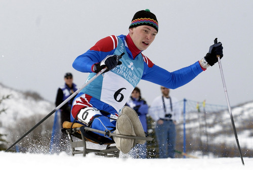 Al Harmann | Tribune file photo
Russia's Taras Kryjanovski takes a downhill corner in the men's 5K sitski race at Soldier Hollow in the 2002 Paralympics.  He finished first.