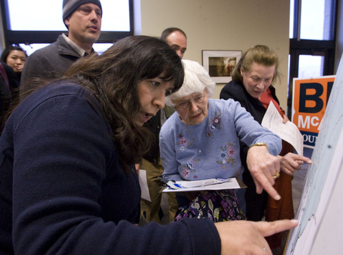 Leah Hogsten  |  The Salt Lake Tribune
State Rep. Rebecca Chavez-Houck (left) helps Sue Marquardt find her way to the right precinct group. Some 27 precincts caucused at the state Capitol cafeteria Tuesday night to elect delegates to the party's county and state conventions. These delegates will decide who receives the Democratic nominations for elected offices.