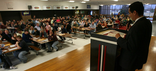 Steve Griffin  |  The Salt Lake Tribune

State Sen. Ross Romero, D-Salt Lake City, a candidate for Salt Lake County mayor, talks to caucusing party members at Eisenhower Junior High School in Taylorsville on Tuesday night. Romero and fellow Sen. Ben McAdams are battling for the Democratic nomination to take the place of outgoing mayor Peter Corroon.