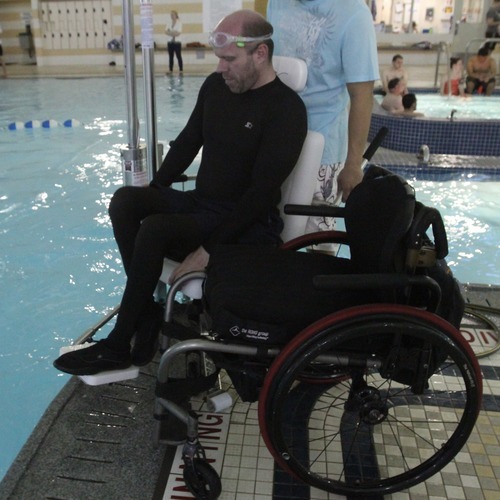 Rick Egan  | The Salt Lake Tribune 

Dave Gillespie, Bountiful, transfers to the lift to enter the pool, at the Holladay Lions Recreation Center, Wednesday, March 14, 2012. Thursday is the compliance deadline for Americans with Disabilities Act design standards.